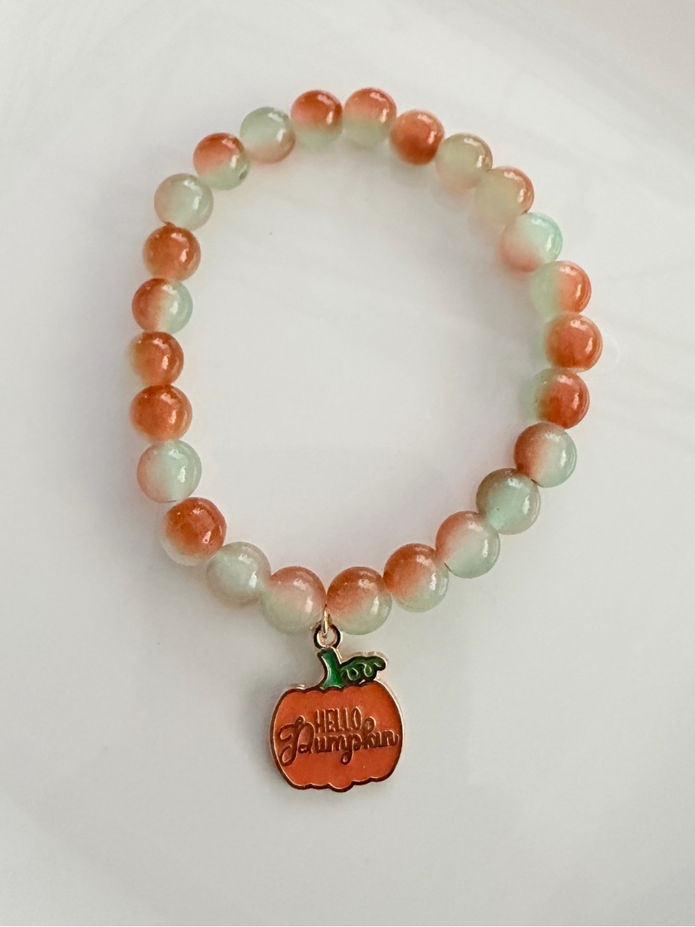 Orange and Cream Beaded Stretch Bracelet with Pumpkin Charm